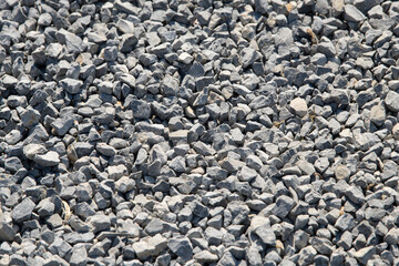 Gravel on the path. Gray stones. Gravel used in making th walk sidewalk