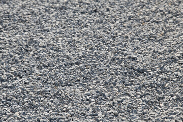 Gravel on the path. Gray stones. Gravel used in making th walk sidewalk