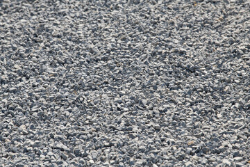 Gravel on the path. Gray stones. Gravel used in making th walk sidewalk