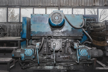 Old milling machine equipment with electric flange motors tool for metalworking in the workshop of the industrial plant