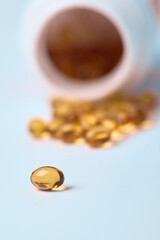 Omega 3 capsules on a light background