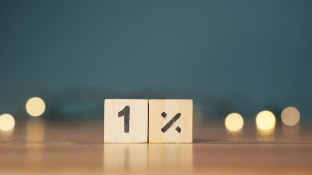 wooden cubes with the number 1 percent. business concept. marketing concept