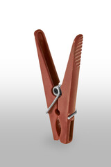 clothespin, plastic, brown, steel spring.