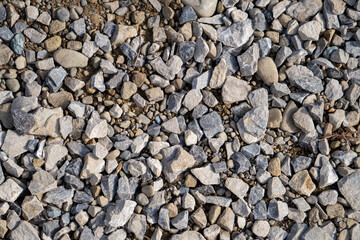 Crushed stones background on the railway. Close up stone texture, Crushed stone, railway ballast. Stones background.