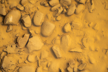 Crushed road stones under water on the country road