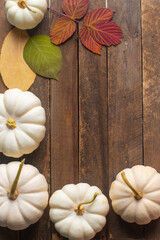 pumpkins are white on a wooden background. High quality photo