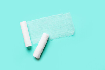 White gauze rolls on color background