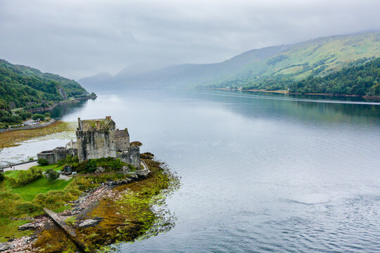 Aerial view of a beautiful Scottish castle on the shores of a sea loch (Eilean Donan, Highlands)