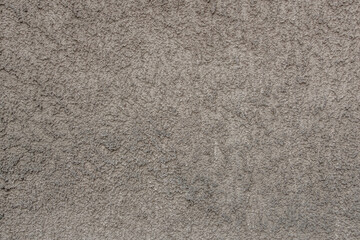 abstract background of an old embossed plastered concrete wall close up