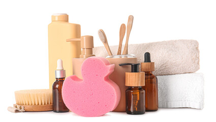 Bath supplies, brush, sponge and towels on white background