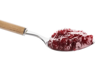 Spoon of tasty cranberry jam on white background