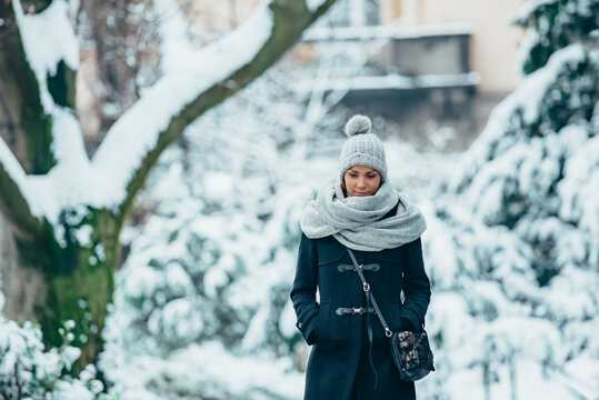 Beautiful Young Woman Wearing Scarf And A A Hat On A Cold Winter Day