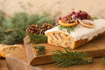 Boards with tasty Christmas bread on table