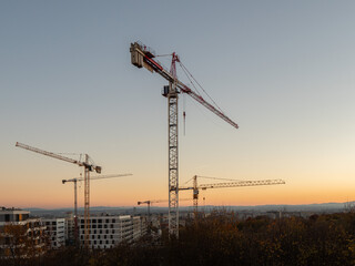 Construction crane on a construction site used for the construction of residential houses