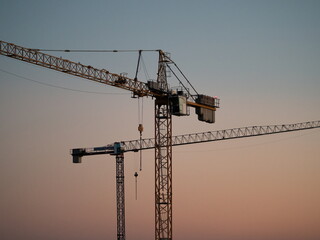 Construction crane on a construction site used for the construction of residential houses © Michal