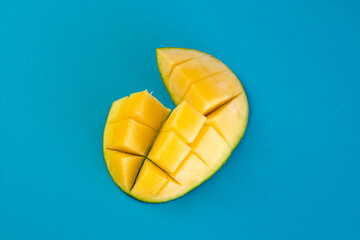 Cut half a juicy mango into pieces