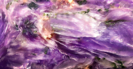 Close-up of polished charoite surface, natural stone pattern , background