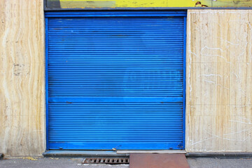 Old Rolled Blue Steel Door of garage