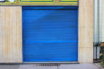 Old, blue door of garage