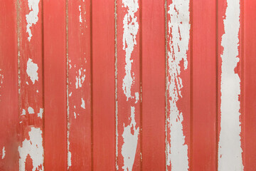 Red peeled old paint abstract pattern with white metal fence surface texture background