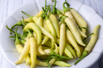Fresh and organic yellow colored small hot peppers