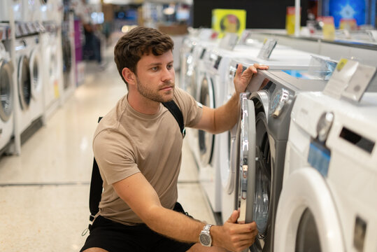 Male buying new washing machine