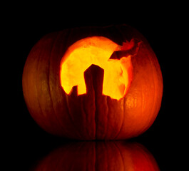 Pumpkin carved with landscape of Gran Canaria and a bat 