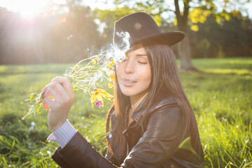 brunette girl in the park on a sunny autumn day