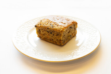 Square sliced carrot cake in a round plate