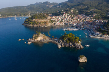 Fototapeta na wymiar Aerial shot of church on island at the port town of Parga in West Greece Preveza