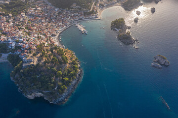 Aerial shot of medieval fort and port town of Parga in West Greece Preveza