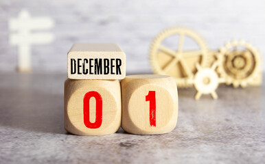 December 1st. Image of december 1 wooden color calendar on white brick wall background. empty space for text
