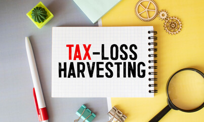 Conceptual photo about Tax-Loss Harvesting with handwritten text.