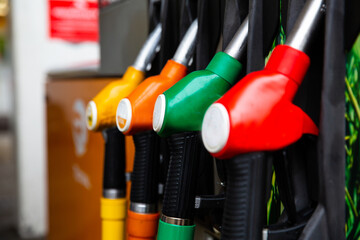 Detail of a petrol pump in a petrol station. Blue, green, red, golden colors.