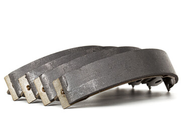 Set of asbestos brake pads, replacement spare parts of the car brake system, isolated on white...