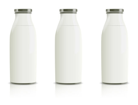 Milk bottles lined up and filled with pure white milk