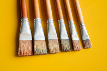 Fototapeta premium Oil painting brushes yellow blue background art 