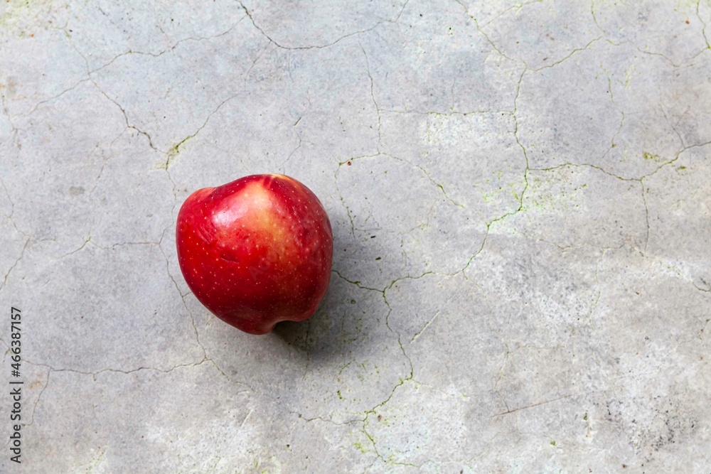 Sticker Close - up of bright red apples on stone tabletop