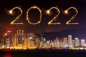 2022 Happy New Year fireworks over Hong Kong cityscape at night