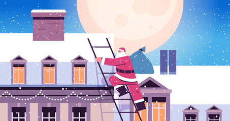 santa claus climbing to the roof of house building merry christmas happy new year winter holidays celebration © mast3r