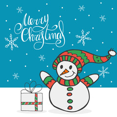 A snowman in a red and green hat and scarf with a gift on the background of falling snowflakes. Handwritten lettering - Merry Christmas. Happy New Year 2022. Hand-drawn doodle.