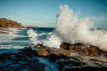 Fototapeta na wymiar Waves Splashing on the rocks