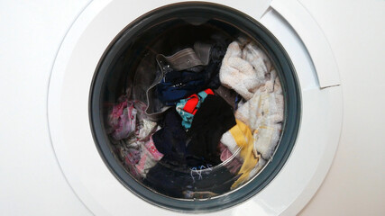 A drum of a washing machine with laundry close-up