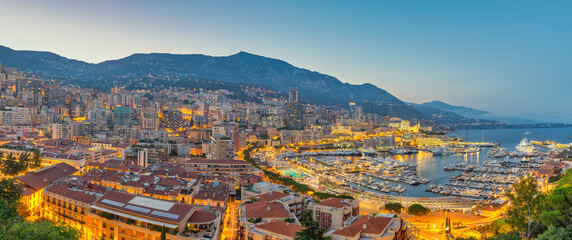 Fototapeta na wymiar Monte Carlo Monaco, ponarama night city skyline at Ville port