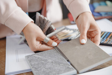 Woman interior designer chooses grout color for ceramic tiles