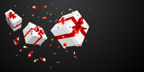 Vector illustration with flying white gift boxes with red ribbons and bows, and small blurry pieces of serpentines on black background