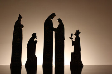 Silhouette nativity scene, reflected on the surface.