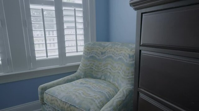 Interior shot bedside press gimbal towards armchair