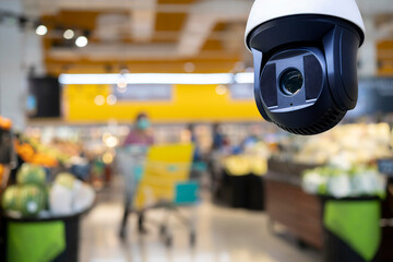 CCTV and blurred supermarket store blur background.