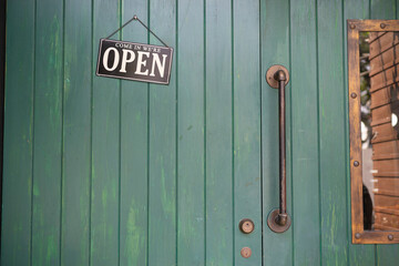 Welcome open sign on shop door .vintage tone stye